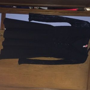 Black womens v neck dress with lace sleeves.